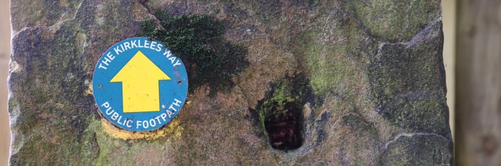 Stone post with Kirklees Way direction sign