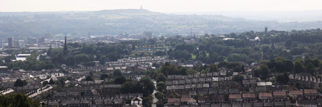 terraced housing and green space in Huddersfield, looking from the north towards Castle Hill