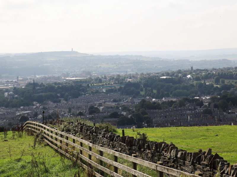 Huddersfield seen from fields to the north, looking over the town centre to Castle Hill.